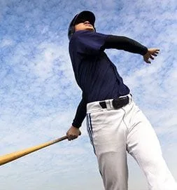 A baseball player swinging a bat in the air.